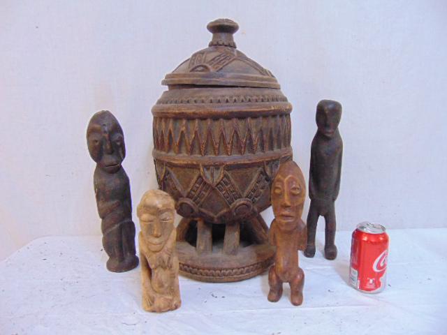 Large African carved wood vessel & 4 figures, large: Large African carved wood vessel & 4 figures, large lidded urn, vessel with carved decorations, height is 21" plus 4 carved wood tribal figures. Note this lot came from the collection of a noted Ameri