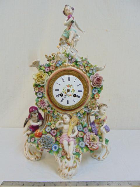 German beehive mark porcelain figural clock, Dresden or: German beehive mark porcelain figural clock, Dresden or Meissen style, various repairs & dial is chipped around key hole 18.75" tall