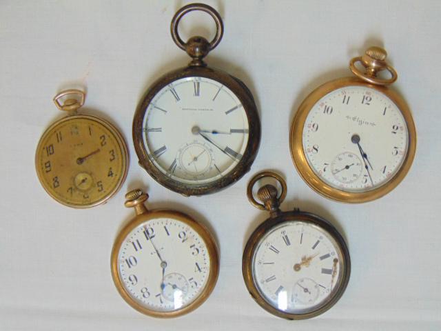 (5) Pocket watches, Gold filled & sterling lot to: (5) Pocket watches, Gold filled & sterling lot to include Elgin 1903 GF; Elgin GF monogrammed case; Wadsworth GF missing crystal; National Watch Co. marked Dueber coin 200370; & pocket watch market Cy