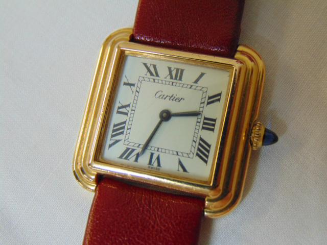 Cartier Tank watch, original receipt: Cartier Tank watch original receipt 1984 w/ Cartier guarantee certificate, Gold plated marked Plaque OR 20M, Swiss, 11 01133, red leather band is not original. (Tissot) watch not working.
