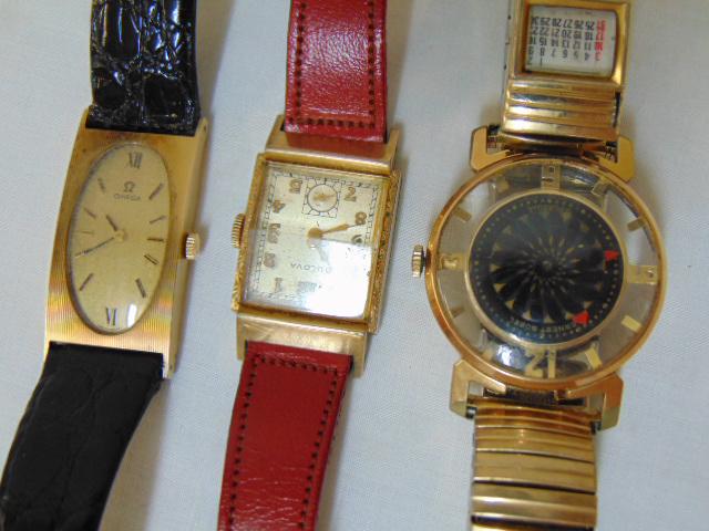 (3) Vintage watches, Omega14k; Bulova 14k; & stainless;: (3) Vintage watches, Omega14k; Bulova 14k; & stainless; Ernest Borel Kaleidoscope gold plated w/ calendar. 14k Omega watch original black alligator strap marked OMEGA; 14k Bulova & stainless marked on