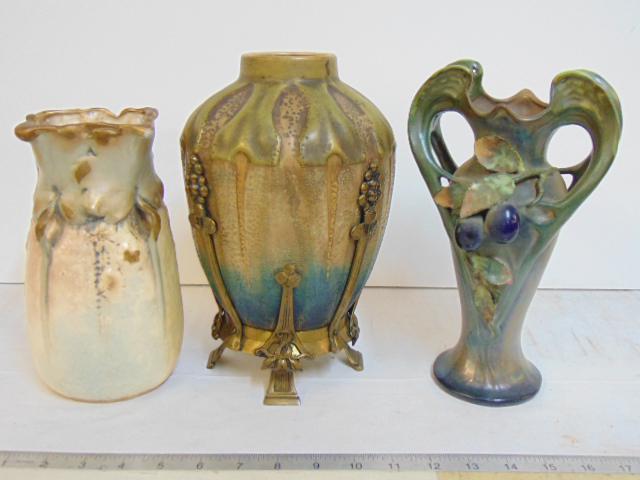 3 Amphora art pottery vases, bronze patina footed art: 3 Amphora art pottery vases, bronze patina footed art pottery vase, height is 10.25", ivory colored vase with gilt detail & 4 small handles plus green art nouveau style vase, double handles with grape