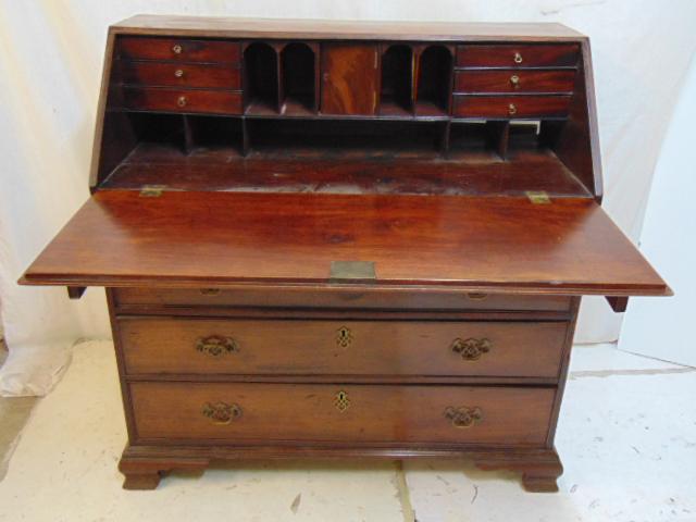 Antique mahogany slant front desk, Chippendale style, 4: Antique mahogany slant front desk, Chippendale style, 4 drawer, brass hardware, 39.75" by 18.5", height is 31", some veneer damage, loose back panel.