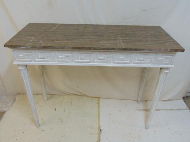 Console table with stone top, Greek key design carved: Console table with stone top, Greek key design carved on skirt, in white paint, table is 48" by 20", height is 35.75"