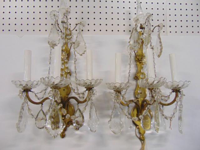 Pair brass & crystal wall sconces, each sconce has 3: Pair brass & crystal wall sconces, each sconce has 3 arms with crystal cup, height is 22.5"