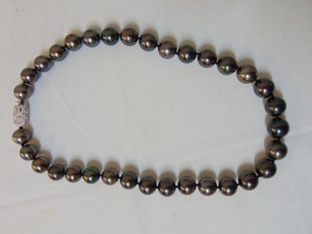 Jewelry. Tahitian Pearl necklace w/ 14k white gold &: Jewelry. Tahitian Pearl necklace w/ 14k white gold & diamond clasp, signed, 33 black Tahitian pearls, 19" length, approx 13 mm, good condition, very nice strand of pearls