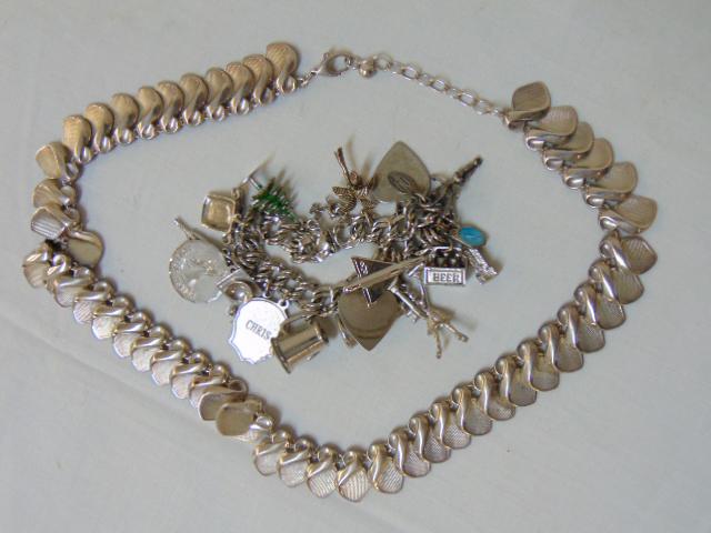 Jewelry. (2) Sterling charm bracelet & sterling: Jewelry. (2) Sterling charm bracelet & sterling necklace , charm bracelet 7" length w/ 15 charms, 64 grams, sterling necklace 18" length, 52 grams