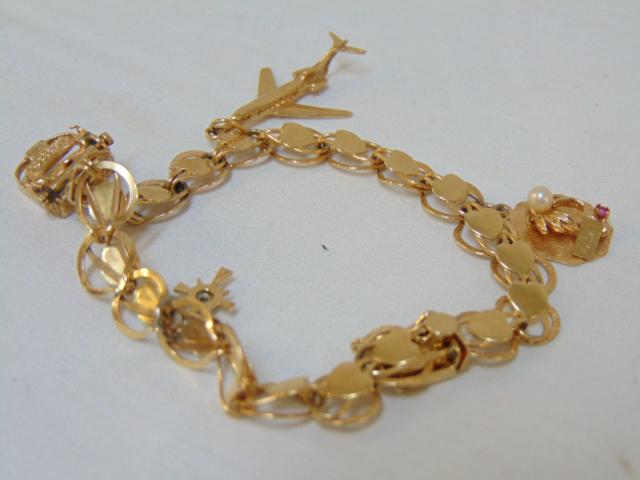 Jewelry. 14k gold charm bracelet w/ 4 charms, length 7: Jewelry. 14k gold charm bracelet w/ 4 charms, length 7 1/2" , 15.5 grams