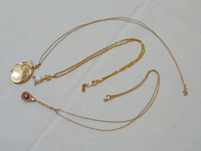 Jewelry. Gold lot to include14k yellow gold oval locket: Jewelry. Gold lot to include14k yellow gold oval locket w/ 14k chain, 19 inches in length 6.7 grams; 14k gold opal cat pendent w/ 14k chain, 17 inches in length, 3.5 grams, & 14k yellow gold Lavalier 