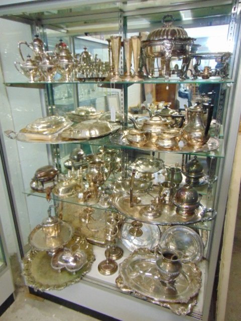 Large lot of fine quality silver plate, showcase filled: Large lot of fine quality silver plate, showcase filled, includes tea sets, candelabra, serving platters, salts and lots more, see images!