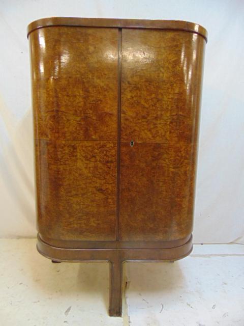Art Deco bar, double rounded doors, burl veneer, on 3: Art Deco bar, double rounded doors, burl veneer, on 3 legs, legs / feet have water damage (see images), cabinet is 30.5" by 20.75", height is 48"