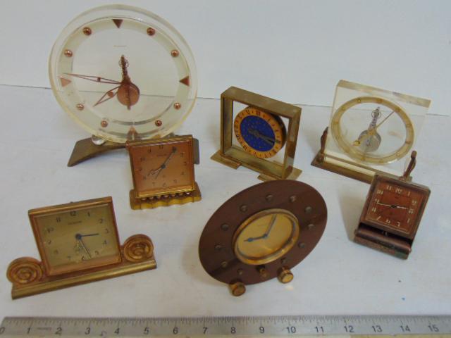 Lot of deco alarm clocks, Lecoultre & other, includes: Lot of deco alarm clocks, Lecoultre & other, includes brass & copper round clock Jaeger LeCoultre, 2 small Lecoultre alarm clocks (one has back missing), small Jaeger brass & silver plate alarm clock,