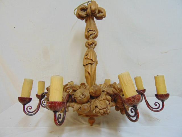Hollywood Art Deco Carved wood hanging fixture, carved: Hollywood Art Deco Carved wood hanging fixture, carved fruit, fixture has 8 painted metal arms with faux wax socket covers, carved wood center column with curtain design, fixture is 27.75" wide, heigh