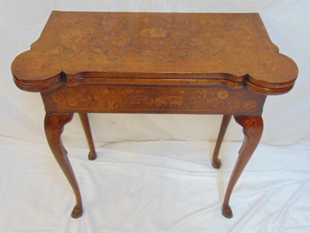 Antique floral inlaid game table, Dutch marquetry,: Antique floral inlaid game table, Dutch marquetry, table is 30.5" by 15" closed, 30.25" by 30.5" open, height is 28.75", hoof feet