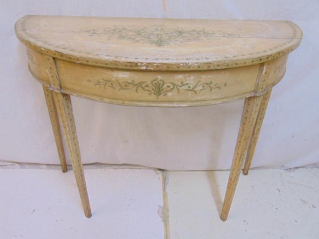 Antique paint decorated demi lune console table: Antique paint decorated demi lune console table, in white paint with green floral & decorative designs, table is 39" by 17.75", height is 29.5"