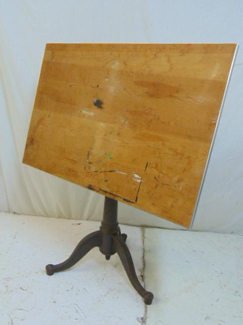 Drafting table, adjustable iron base, stripped pine: Drafting table, adjustable iron base, stripped pine top, top is 37.5" by 24", height adjustable