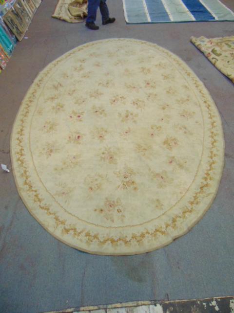 Antique oval Aubusson carpet, floral design, worn: Antique oval Aubusson carpet, floral design, worn, has small hole, as is, carpet is 13'2" by 8'2"