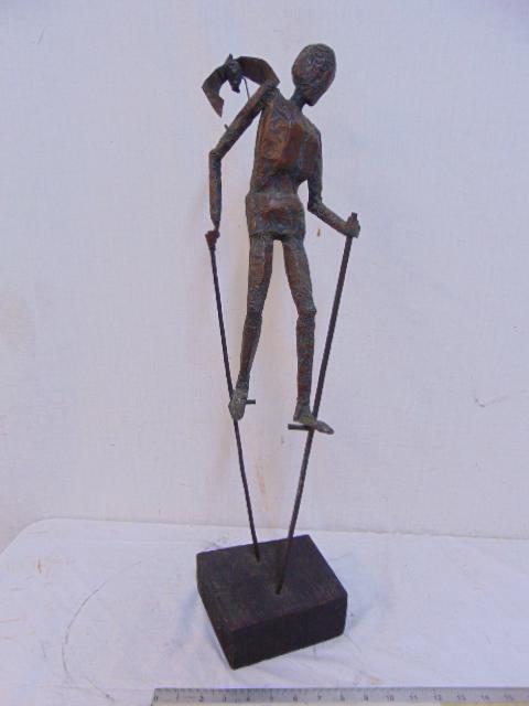 Copper sculpture, figure on stilts, signed "L.J. '60",: Copper sculpture, figure on stilts, signed "L.J. '60", sculpture from sheet copper, figure with bat on shoulder, on wood base, height is 26.75"