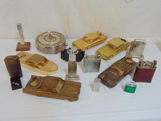 Selection vintage lighters, car form, sterling, leather: Selection vintage lighters, car form, sterling, leather cases & more, brands include Flamidor, The Royal Ascot Table Lighter & more, also includes a mixed metal round box with glass insert.