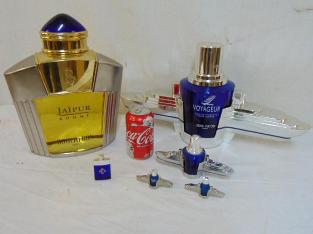 Boucheron & Jean Patou display perfume bottles, "Jaipur: Boucheron & Jean Patou display perfume bottles, "Jaipur Homme Boucheron Paris bottle in brushed aluminum patina with brass & jeweled cap, bottle is 12.5" tall (filled) & "Voyageur:", eau de Toilette P