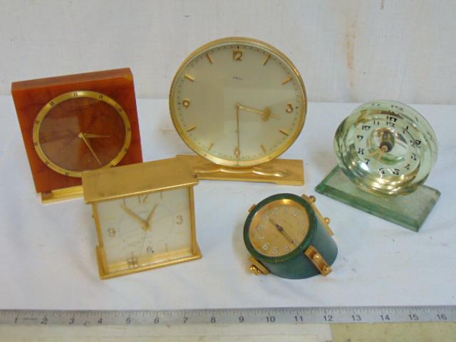 5 desk clocks, brass & Bakelite (?) clock by Jaeger: 5 desk clocks, brass & Bakelite (?) clock by Jaeger LeCoultre; Imhof Swiss 8 day brass desk clock, 8 day glass clock, no make, Andre Wyler brass & leather 8 day clock & Brass electric desk clock by Ca