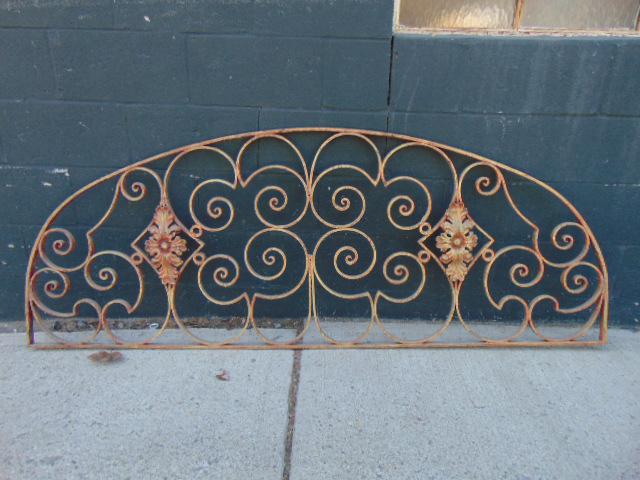 Decorative wrought iron works, arch shaped, over door, (1 of 4)
