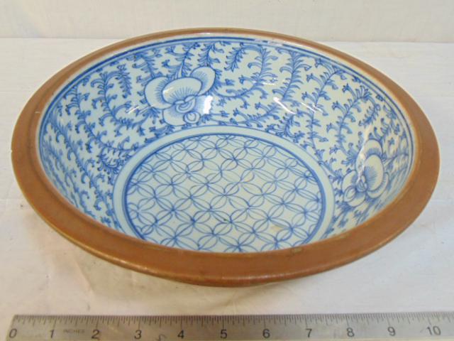 Ceramic bowl, blue & white interior, Asian, Chinese: Asian, Chinese (?) ceramic bowl, blue & white interior, brown exterior, has old was seal on bottom, small chip under rim, 11" in diameter.