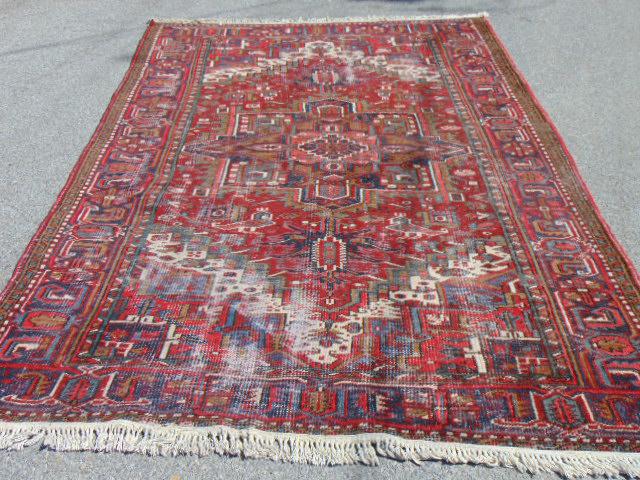 Carpet, in red, center medallion, pile worn, worn: Carpet, in red, center medallion, pile worn, worn areas, rug is 10'5" by 7'