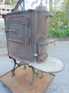 Campaign stove by Catharine Furnace Co, cast iron: Campaign stove by Catharine Furnace Co, cast iron stove, has small old crack in top, on tall legs, stove is 33" deep, 15" wide, height is 36.5"