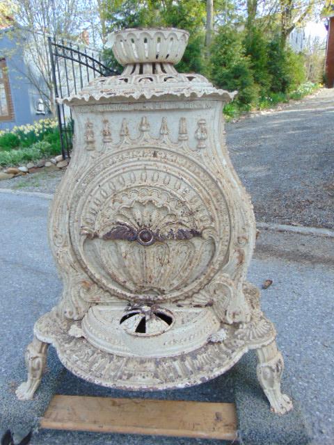 Gothic style cast iron parlor stove, in white paint, by (1 of 8)