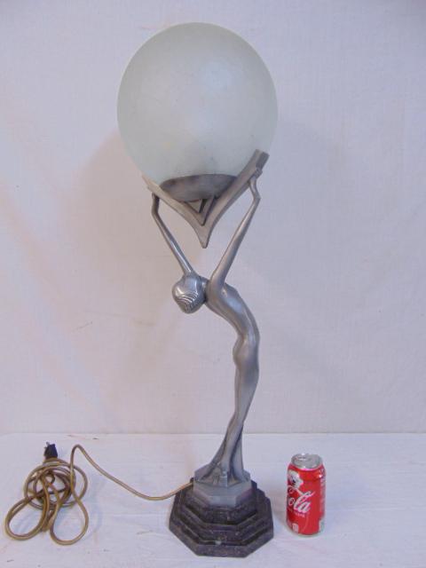 Art Deco figural lamp, glass globe, nude figure holding: Art Deco figural lamp, glass globe, nude figure holding large crackle glass globe, manner of Frankart, height, including globe is 32", on marble base.