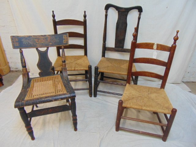 4 odd country chairs, ladder-backs with rush seat chair: 4 odd country chairs, ladder-backs with rush seat chairs (one is rocker with missing rockers), stenciled Hitchcock style chair with caned seat & country chair with rush seat & bow back.