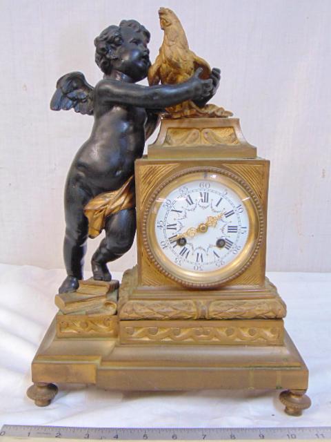 French figural bronze mantle clock, puttu holding (1 of 8)