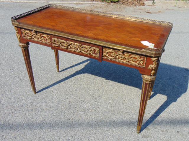 Louis XVI Style Gilt Bronze Mounted Mahogany Marquetry: Louis XVI Style Gilt Bronze Mounted Mahogany Marquetry Writing Desk, 20th century. Height 27"; Width 43", depth is 20"