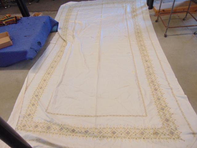 Linen table cloth with gilt embroidered detail,93" by: Linen table cloth with gilt embroidered detail,93" by 167" (14 feet), some stains, needs cleaning.