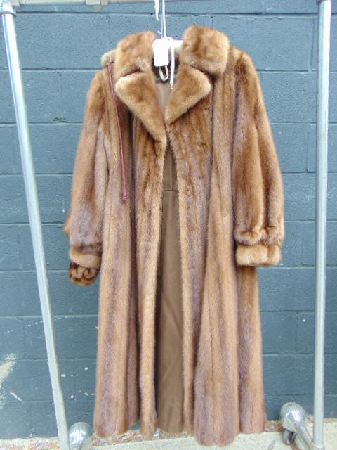 Brown Fur coat, Garfinckel with hood: Brown Fur coat, Garfinckel's with hood. interior "Virginia Webster" laying fur flat underarm to underarm 20" length from shoulder to hem 44 1/2" over all condition good