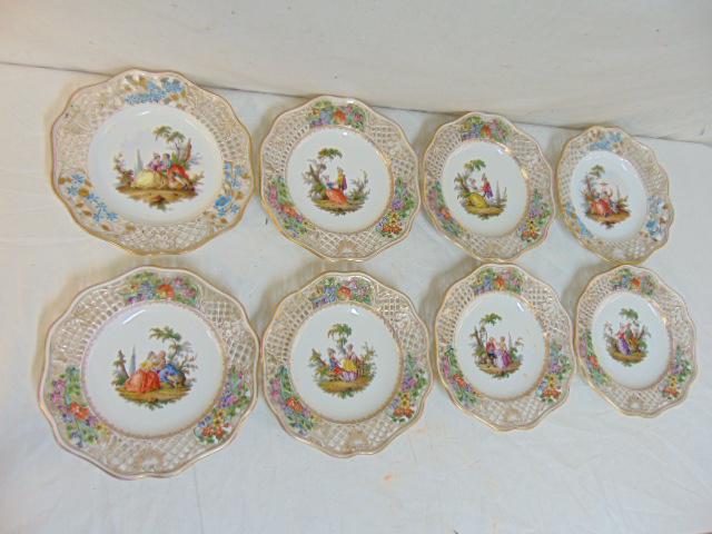 8 Meissen porcelain luncheon plates decorated with: 8 Meissen porcelain luncheon plates decorated with courting scenes, reticulated edge with floral detail, each plate is 8.5", one is as is, repaired, two have different marks and have slightly differen