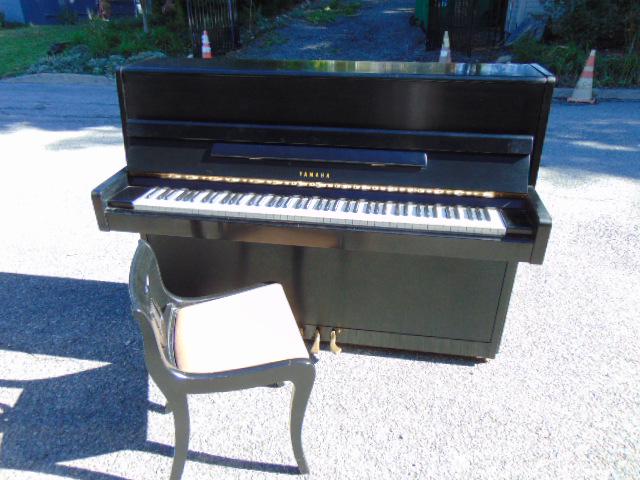 Ebonized Yamaha upright piano, serial # 1501619, with (1 of 9)