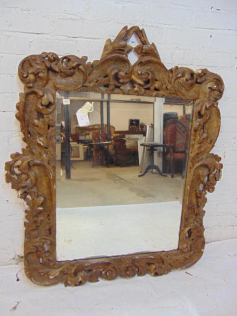 Antique ornate gilt carved wood & gesso mirror, beveled: Antique ornate gilt carved wood & gesso mirror, beveled glass, mirror is 44.5" tall, 38" wide, some loss of gilt, chips.
