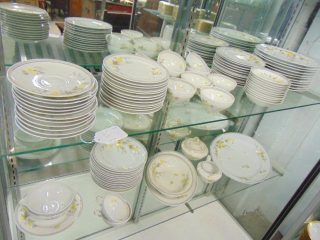 Set Limoges porcelain dinnerware, Charles Ahrenfeldt,: Set Limoges porcelain dinnerware, Charles Ahrenfeldt, floral decorated, includes 12 bread plates, 12 soup plates, 12 cups (one chipped), 11 salad plates, 11 small bowls, 11 dinner plates, sugar & crea