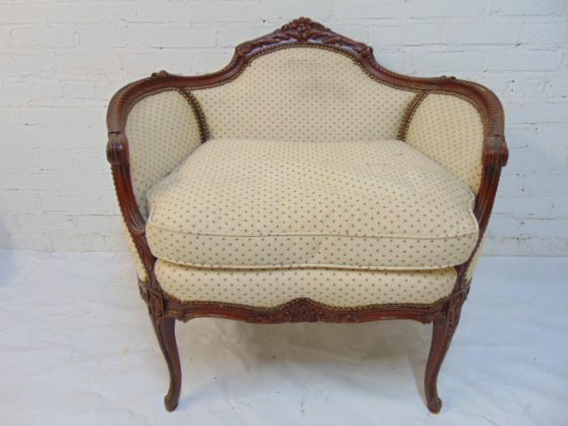 Carved French upholstered chair, floral carvings in: Carved French upholstered chair, floral carvings in back, chair is 26" by 18" (seat), height is 33.5"