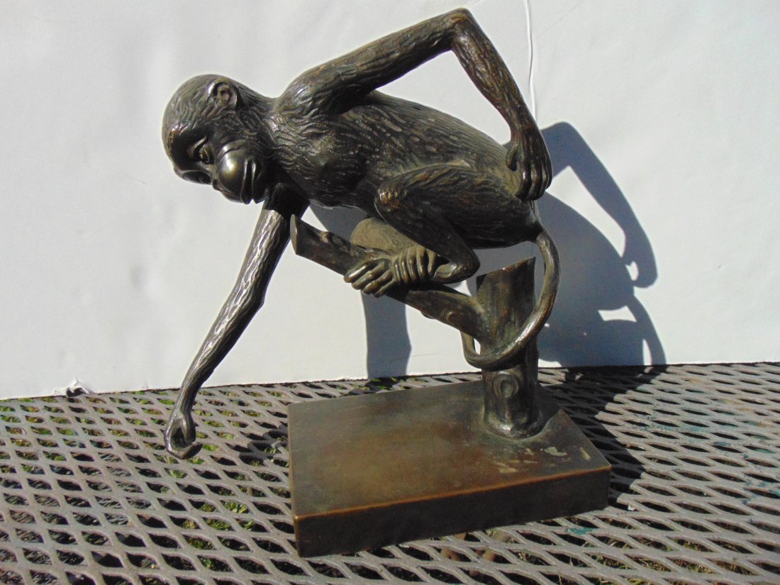 Bronze monkey, perched on branch, appears Asian: Bronze monkey, perched on branch, appears Asian (unsure), unsigned, base is 5.75" by 3.75", height is 8.75", nice patina.