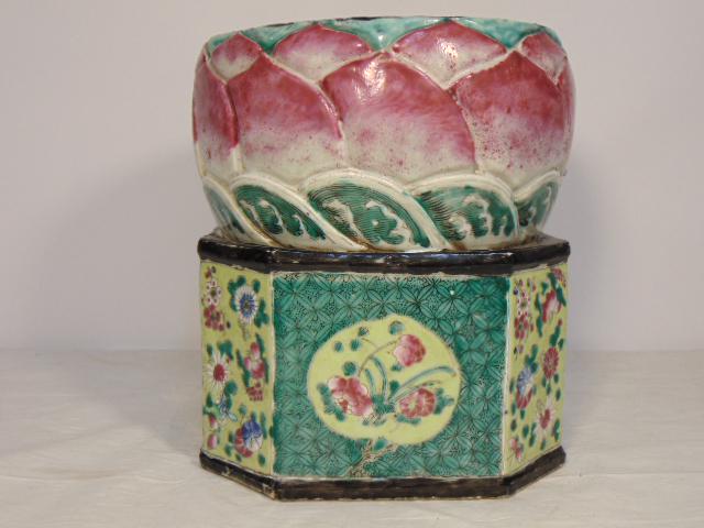 Chinese porcelain pillow, octagonal base & round top: Chinese porcelain pillow, octagonal base & round top with lotus flower decoration, top has a few repairs, pillow is 8" in diameter, height is 8.75"