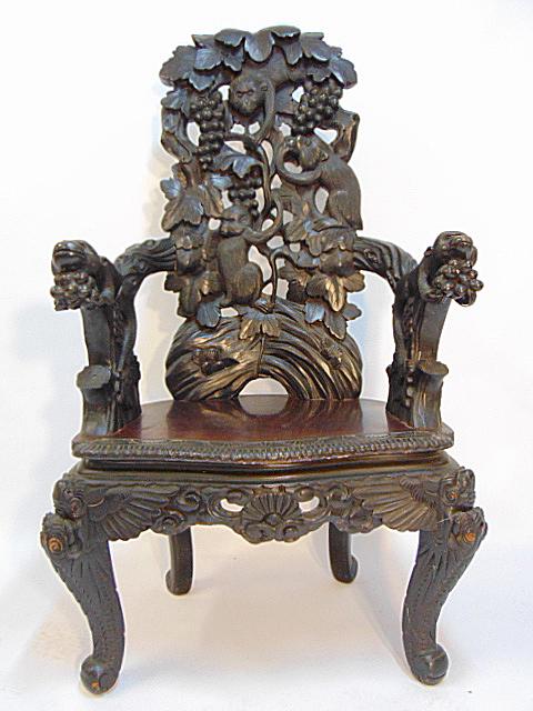 Carved Asian Japanese chair, monkeys eating grapes,: Carved Asian Japanese chair, monkeys eating grapes, chair is 48.75" tall, 26" wide, 20" deep.