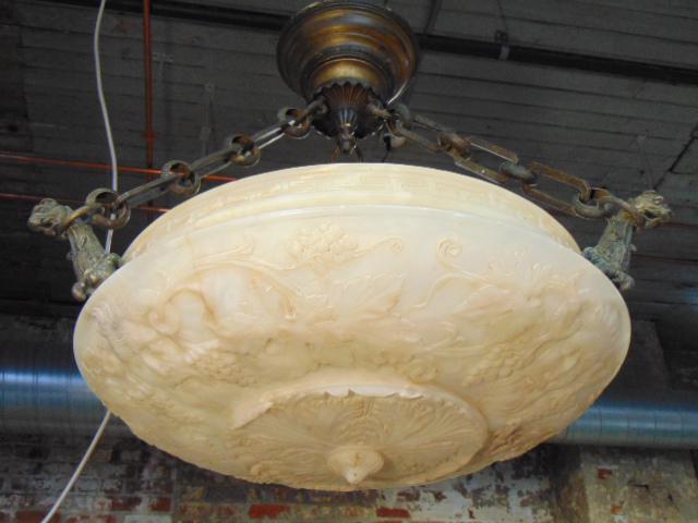 Carved alabaster hanging fixture, decorated with heads, (1 of 10)