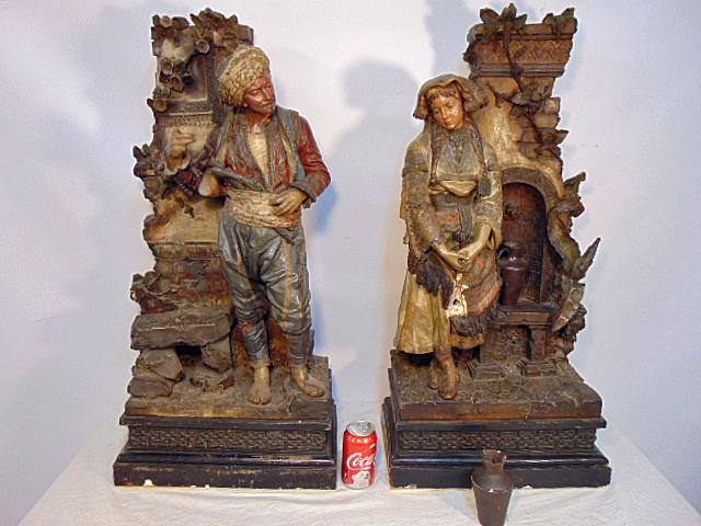 Pair of large Terra Cotta figurals,manner of Friedrich: Pair of large Terra Cotta figurals,manner of Friedrich Goldscheider, man & woman by fountain, hand painted, good detail, some loss, repairs, chips, urn on woman figure repaired and is loose, sculpture