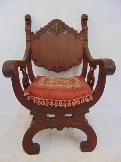 Carved mahogany armchair with lion heads, curved seat & (1 of 4)