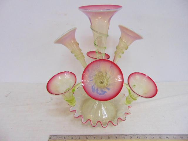 Art Glass Venetian epergne in pink, green & white: Art Glass Venetian epergne in pink, green & white glass, center trumpet vase surrounded by 6 vases, good condition, height is 16". The brass connector that holds the arms is slightly loose, also, one 