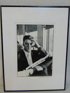 Photograph, Elvis Presley, signed Alfred Wertheimer, 16" by 11", Elvis on the train.: Photograph, Elvis Presley, signed Alfred Wertheimer, 16" by 11", Elvis on the train.