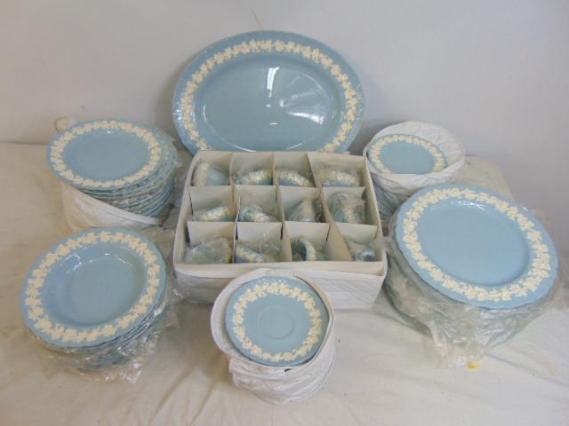 Set Wedgwood embossed Queensware, light blue with white trim, includes 11 soup plates, 12 dinner: Set Wedgwood embossed Queensware, light blue with white trim, includes 11 soup plates, 12 dinner plates, 13 salad plates, 12 cups & saucers, 12 cake plates & oval serving tray.